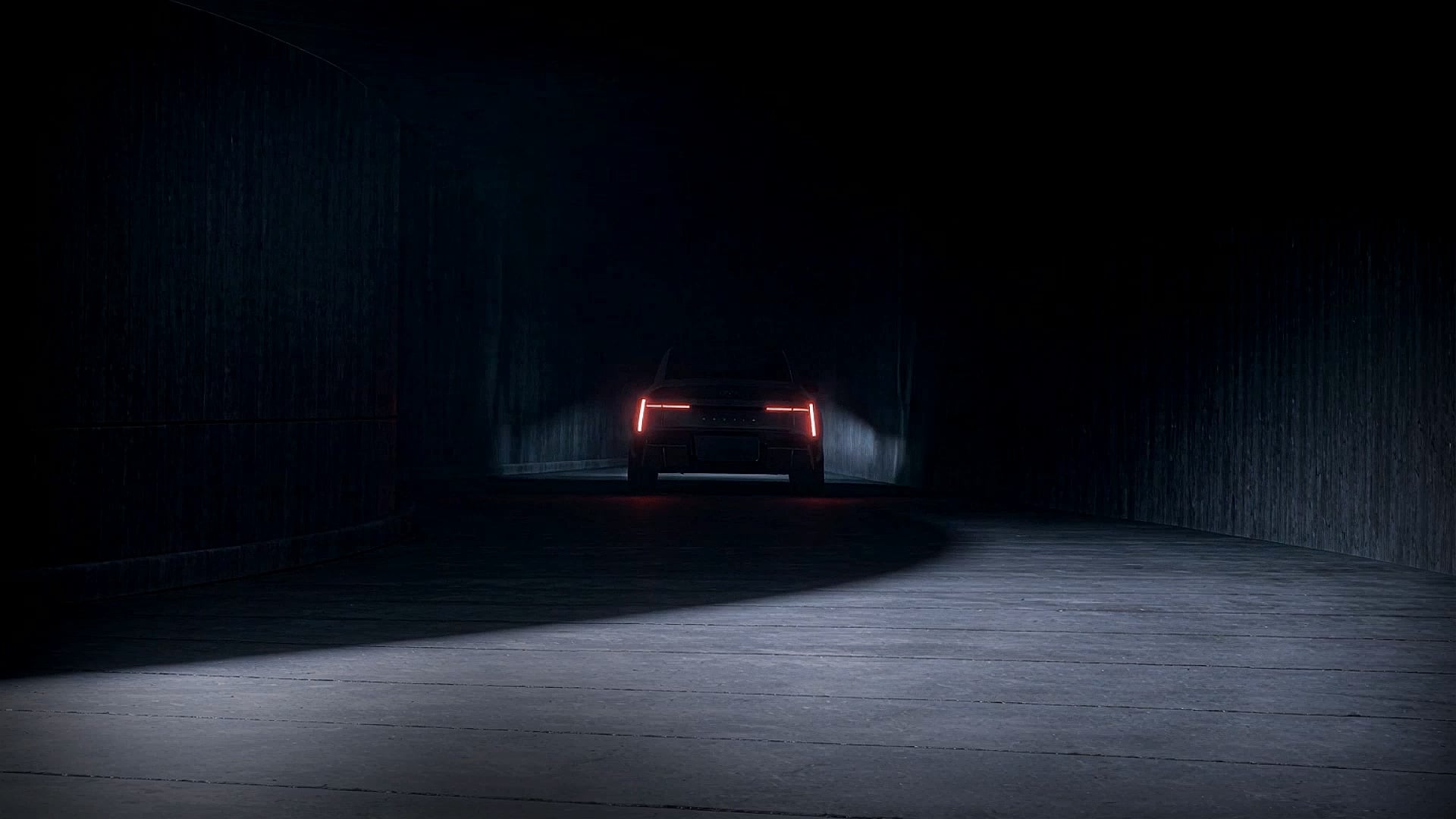 Tail lights in a dark tunnel