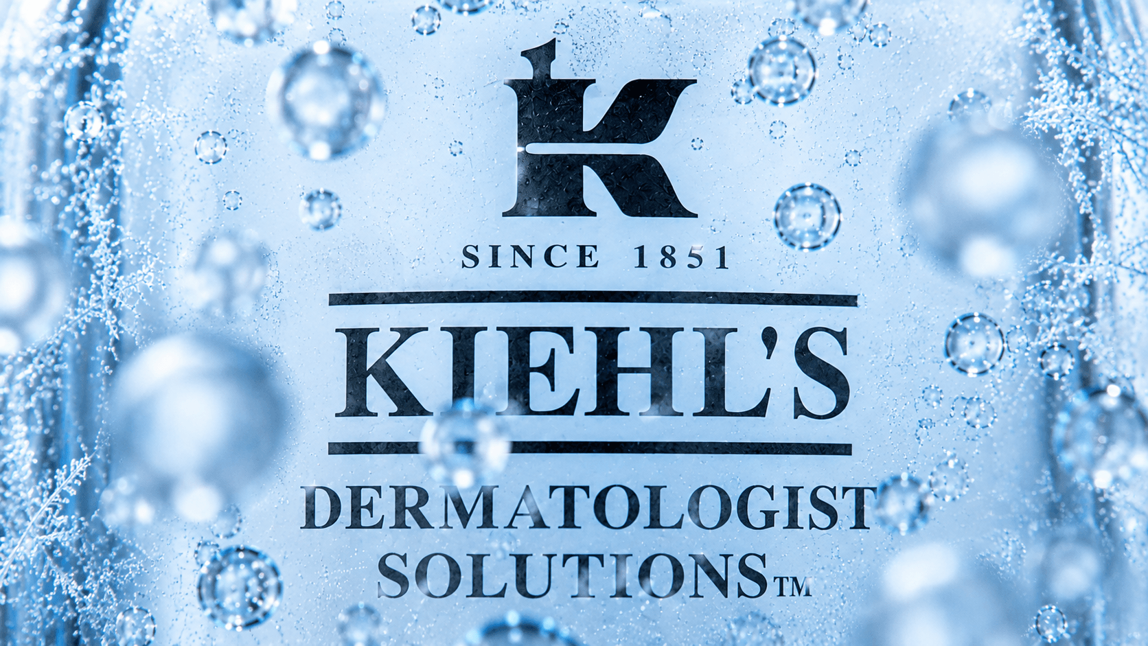 The Kiehl's logo through ice and bubbles