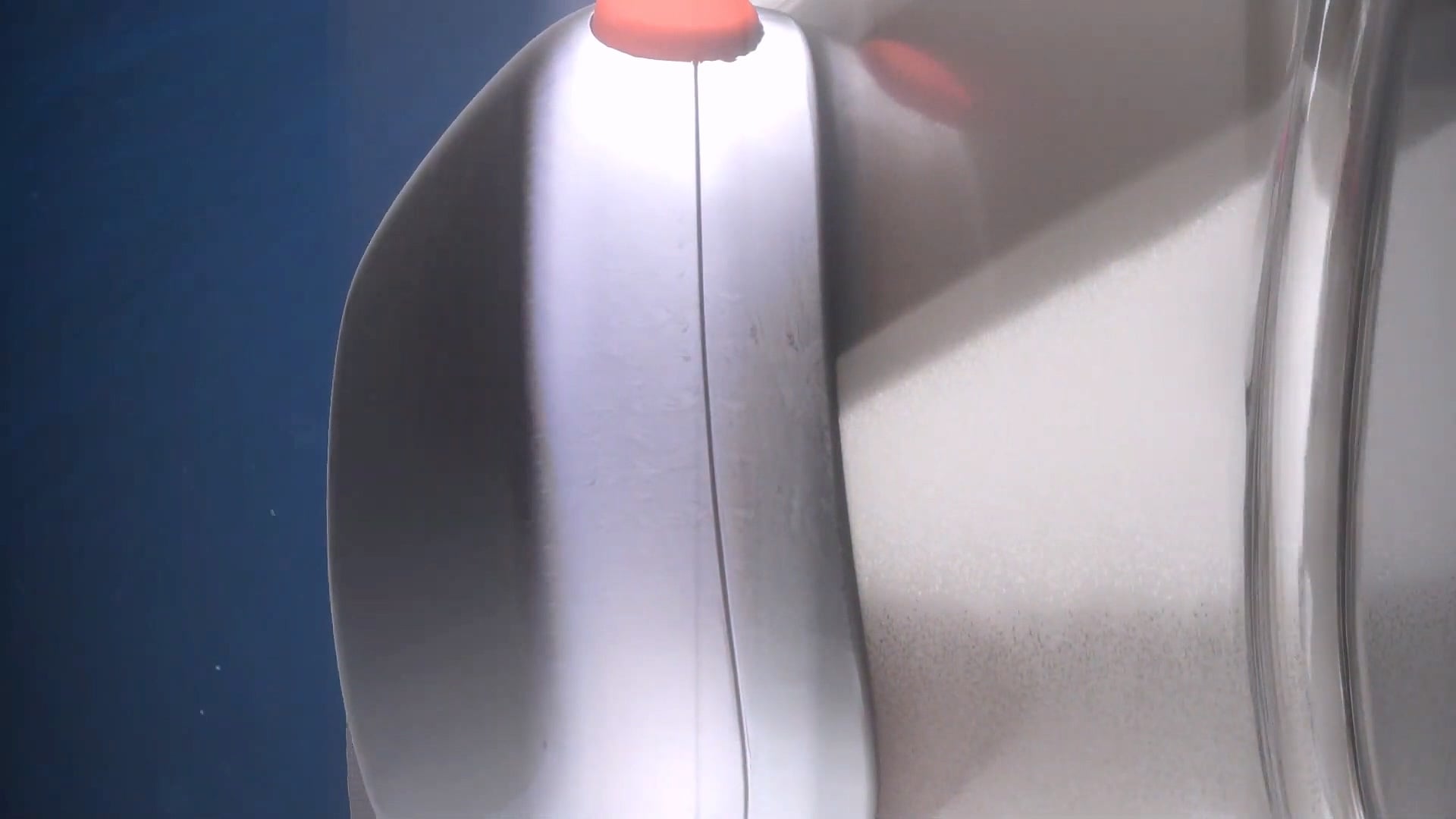 Close-up of the goggles’ side housing with an orange button.