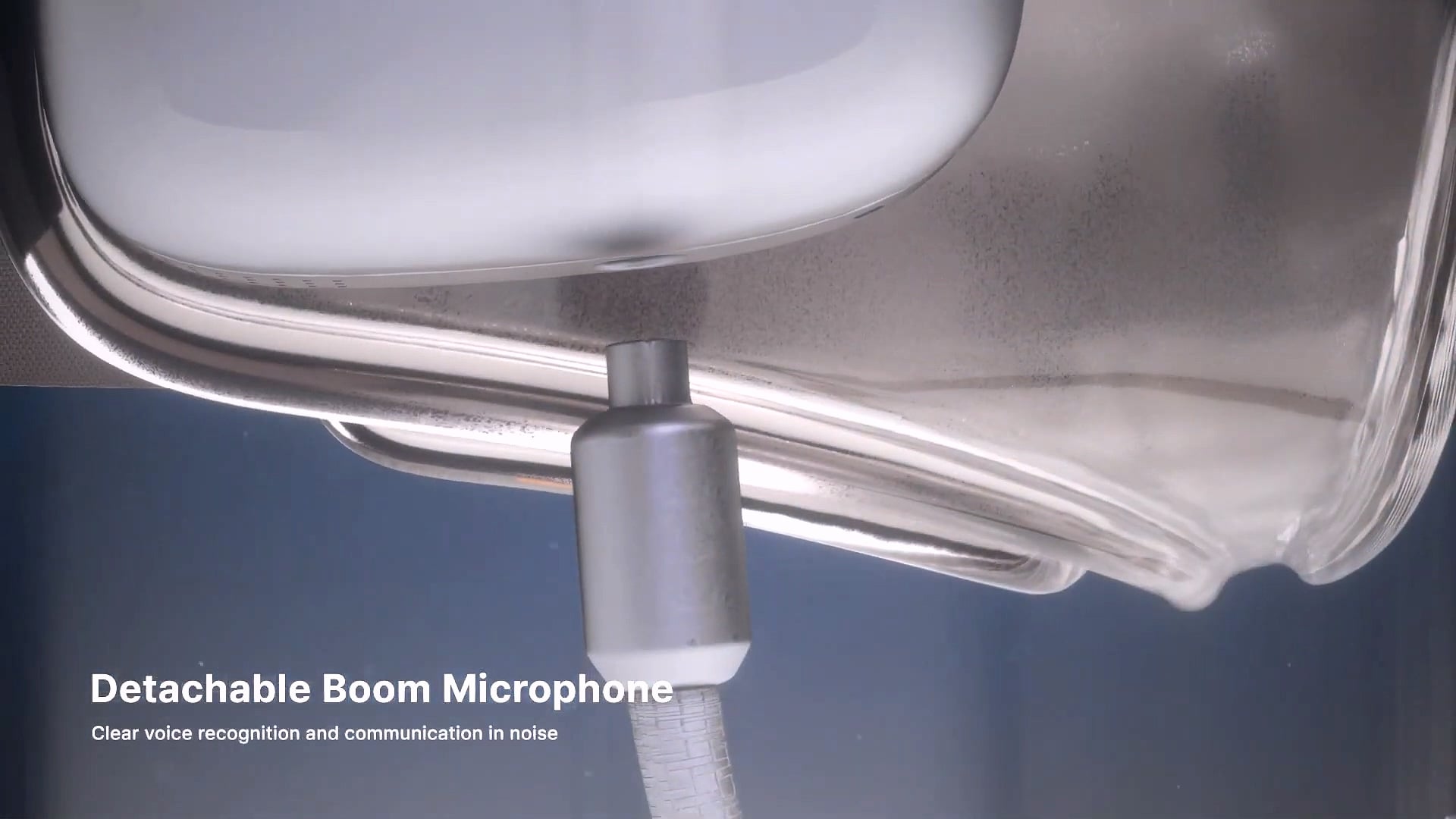 The detachable boom microphone connecting to the goggles.