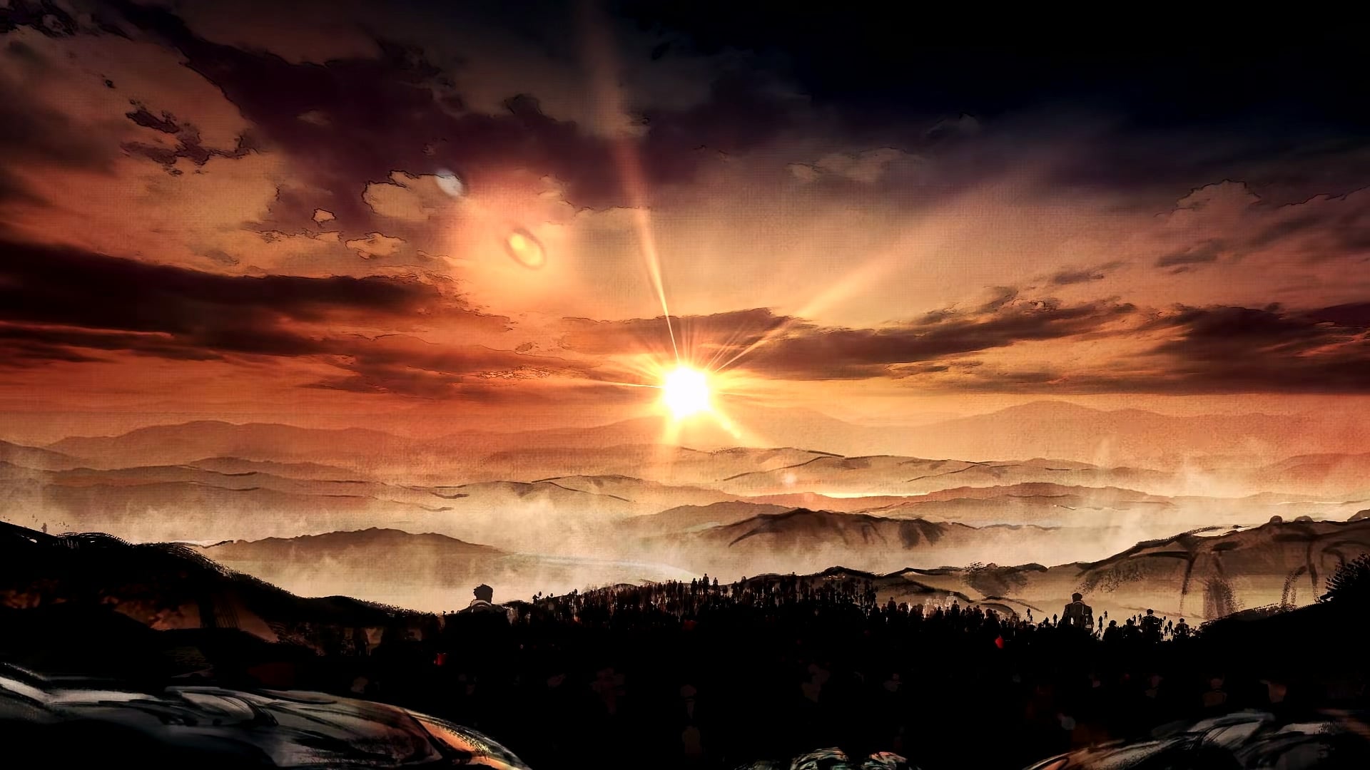 A sunset over misty mountain ridges.
